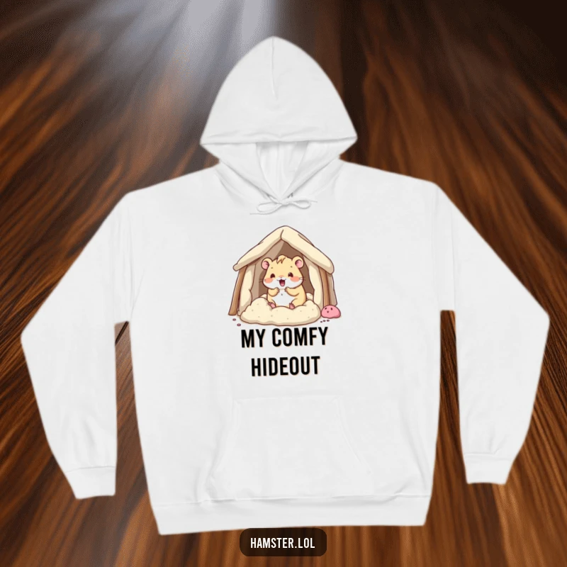 Funny kawaii hamster character enthusiastically building a bedding fort, depicted on a soft and humorous hoodie.