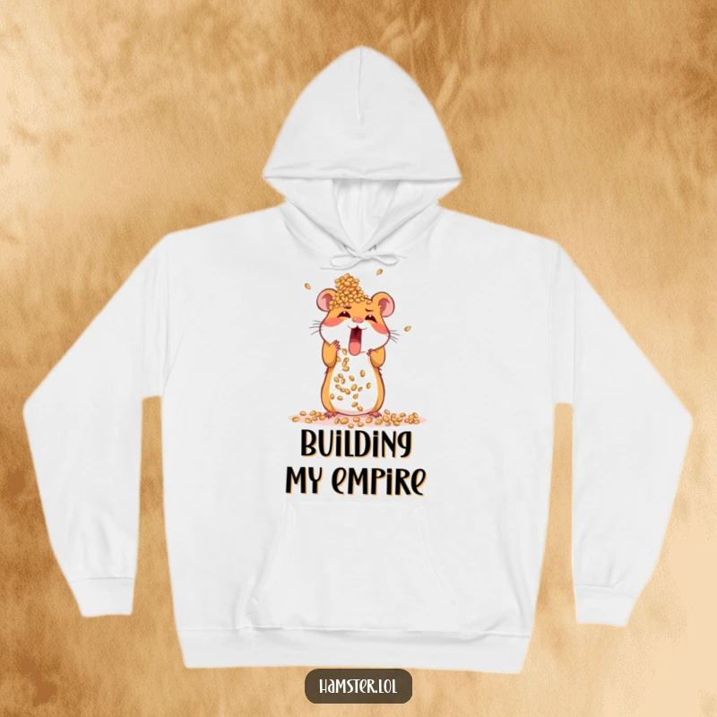 Funny hoodie featuring an excited hamster focused on building a towering structure from seeds, symbolizing ambition.